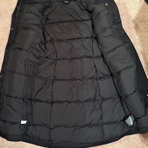 This is a womens North Face Jump Down parka size medium.